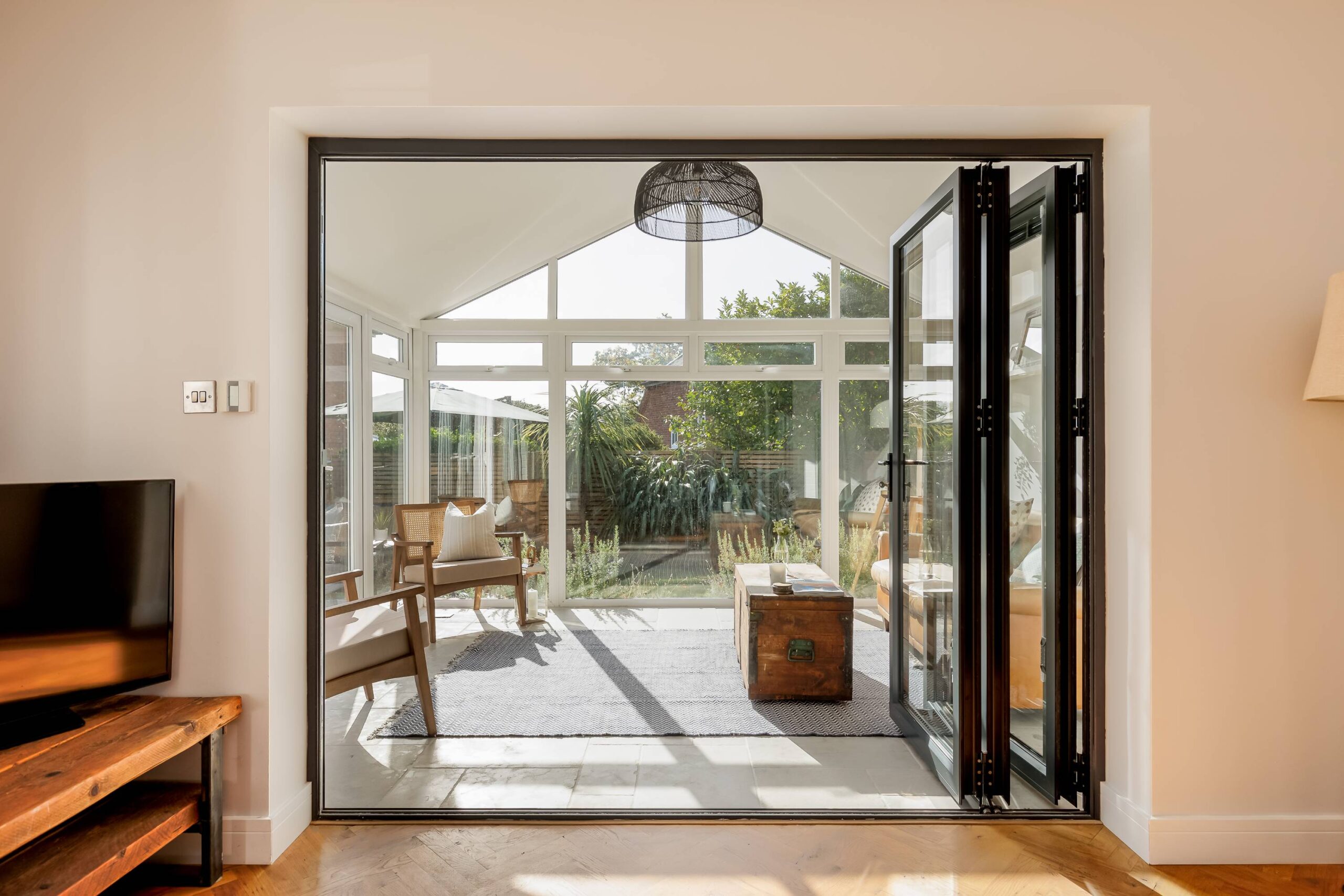 The living room at Ashtree House with a wood burner and gallery wall